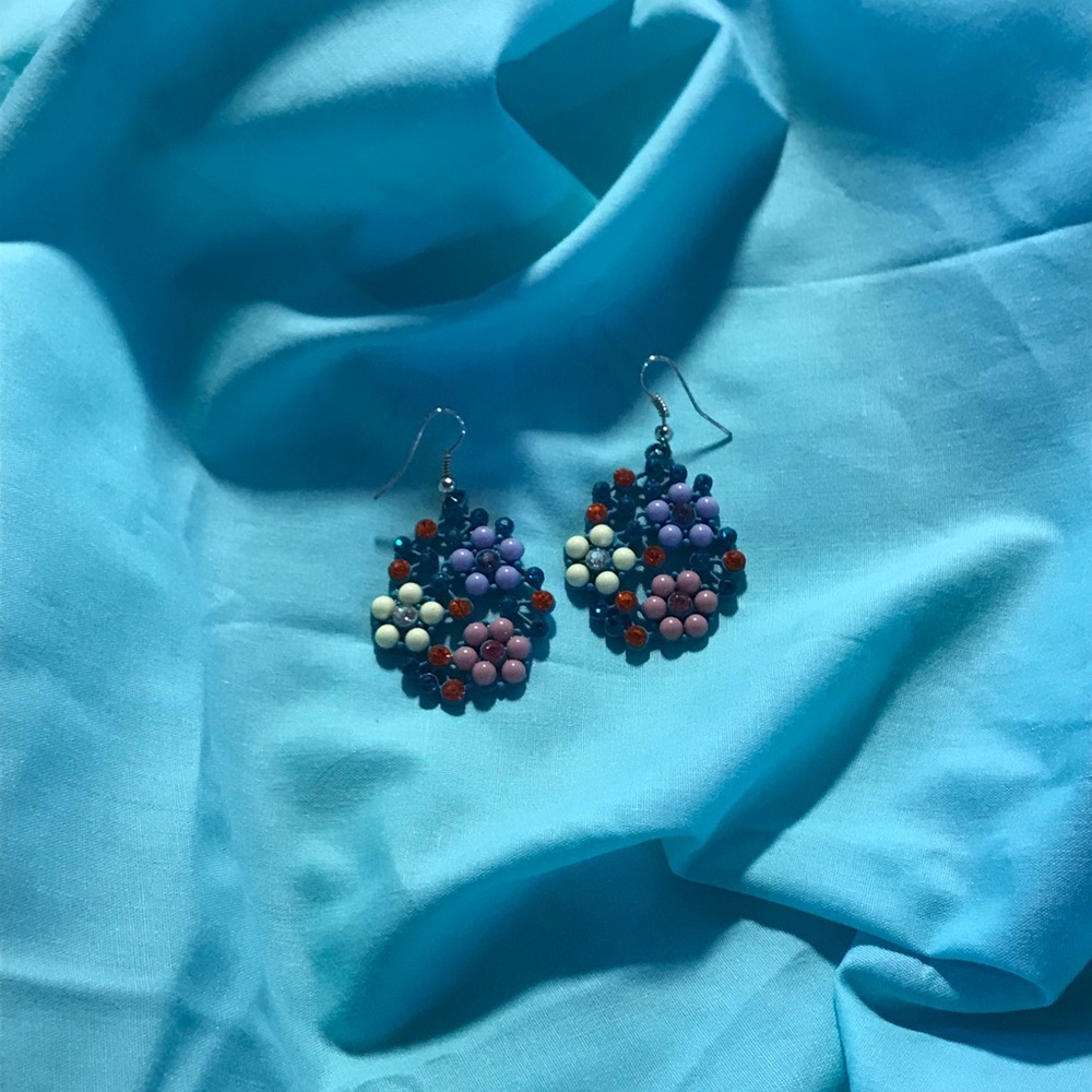 These are earrings that have flowers on them made with the beads on the earrings